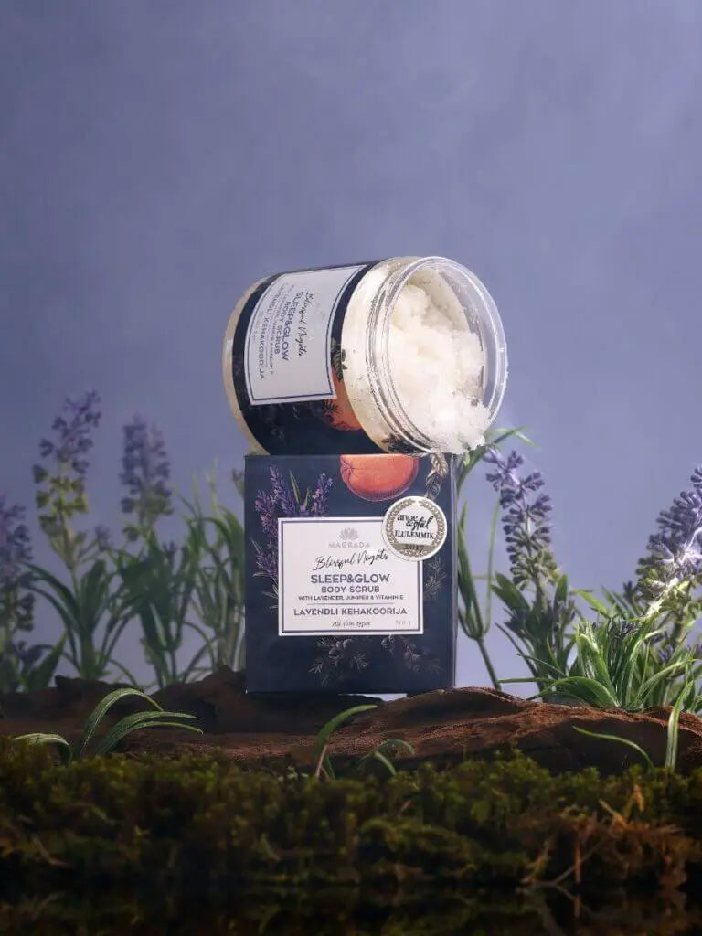 Lavender body scrub from Sleep & Glow Body Gift Set, featuring organic skincare with essential oils, surrounded by lavender plants.